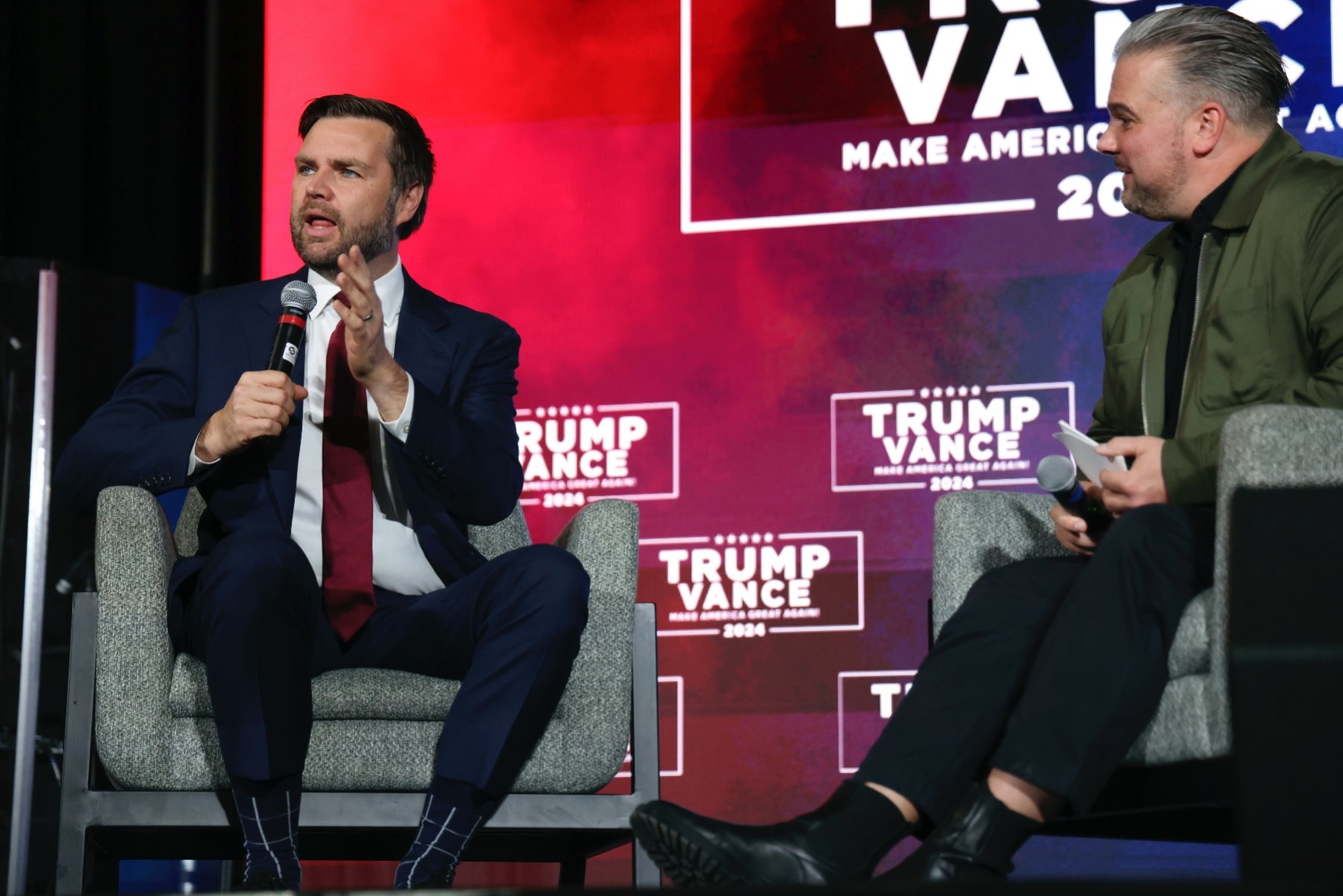 Sen. JD Vance sits on stage to be interviewed