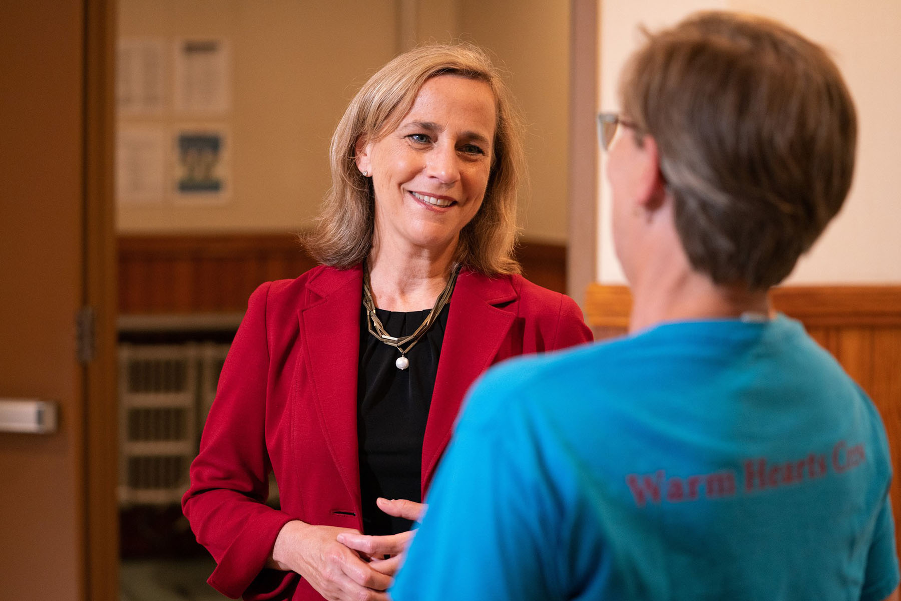 Democratic candidate for New Hampshire governor Joyce Craig smiles as she speaks to a constituent.