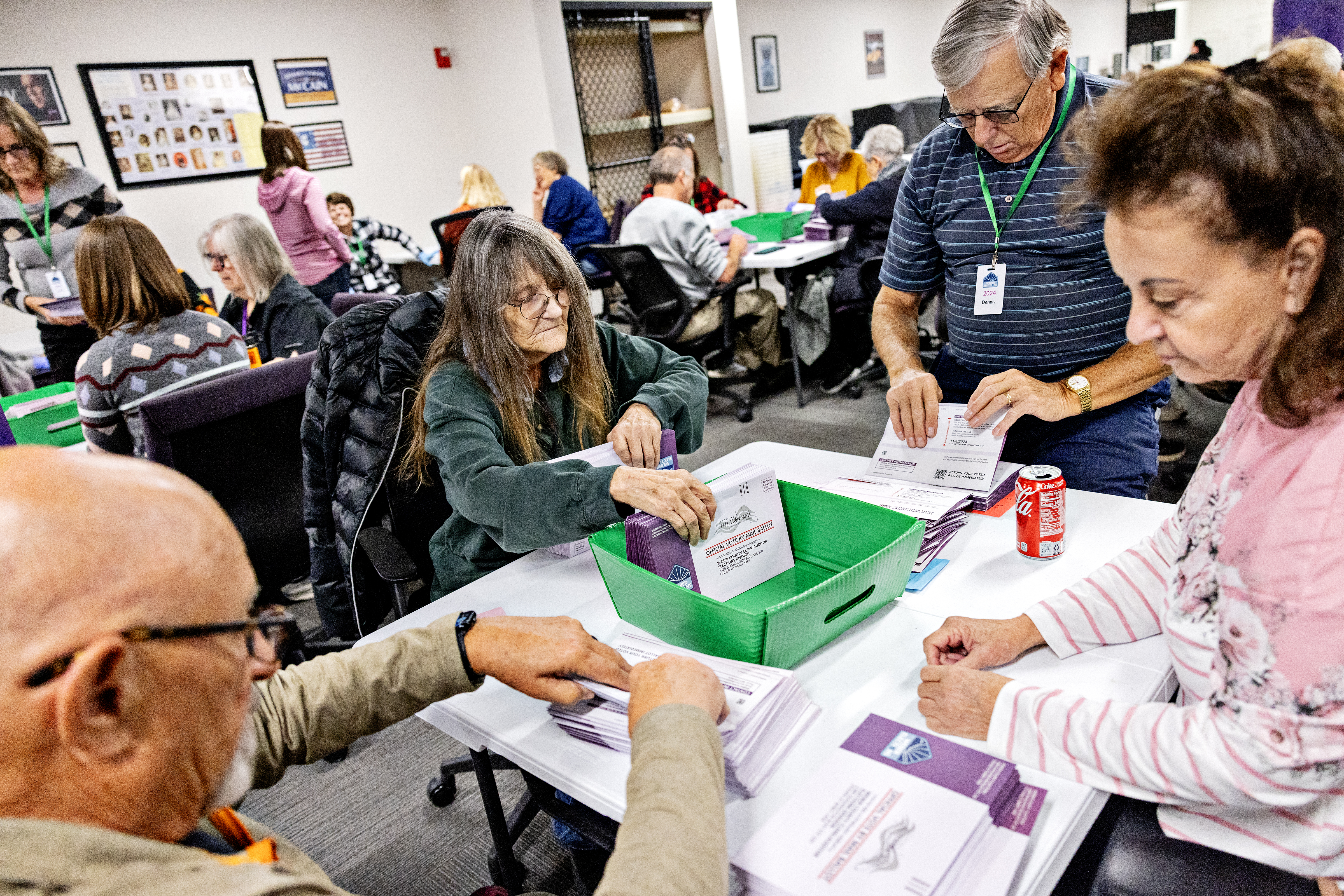 Poll workers sort through returned mail in ballots at the Weber County Clerk Auditor on Friday, October 25, 2024 in Ogden, UT.