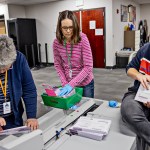 Monica Williams, a worker for the Weber County Clerk Auditor office, handles ballots.