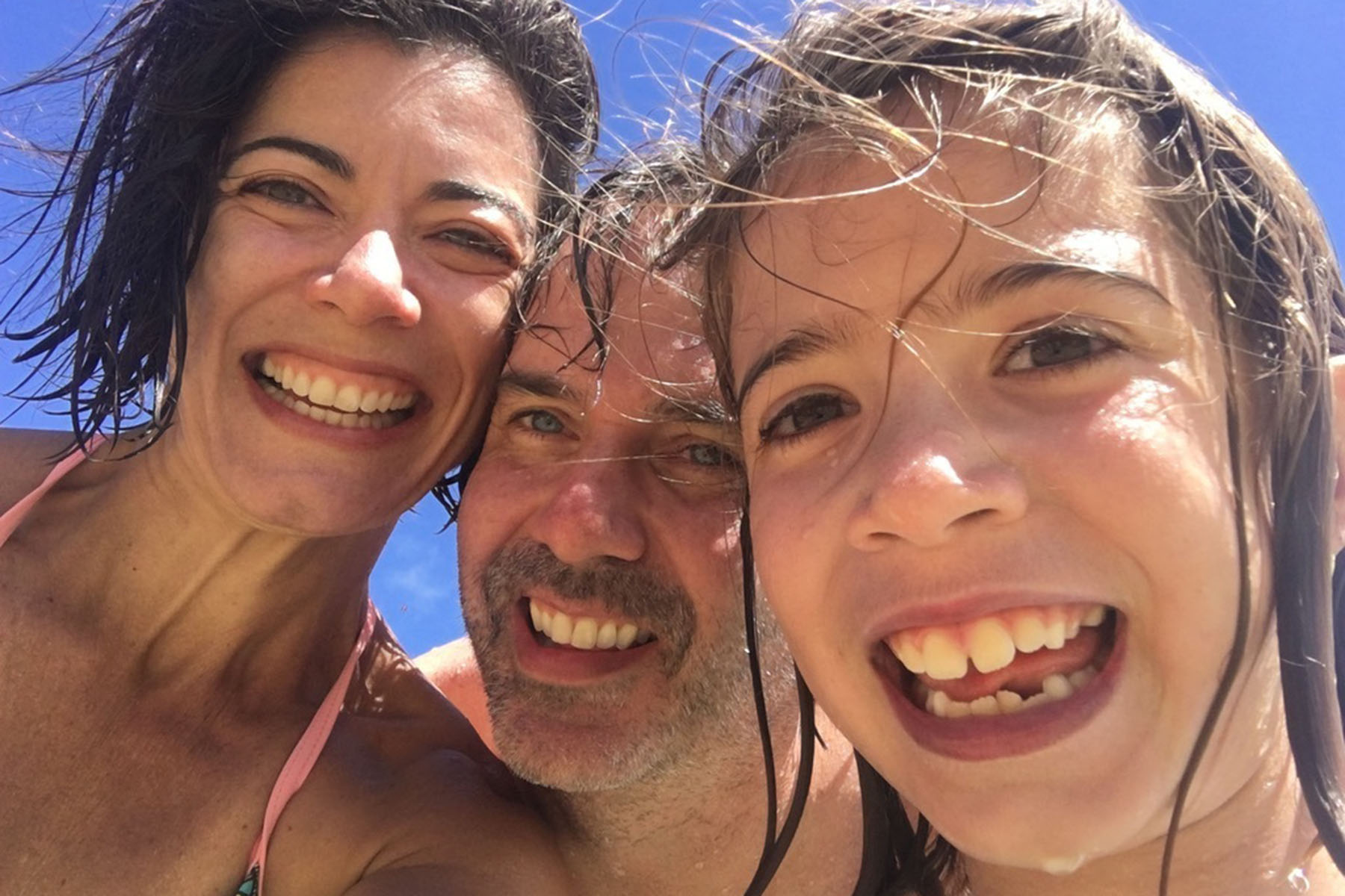 Fernanda Santos and her family are seen smiling at the beach.