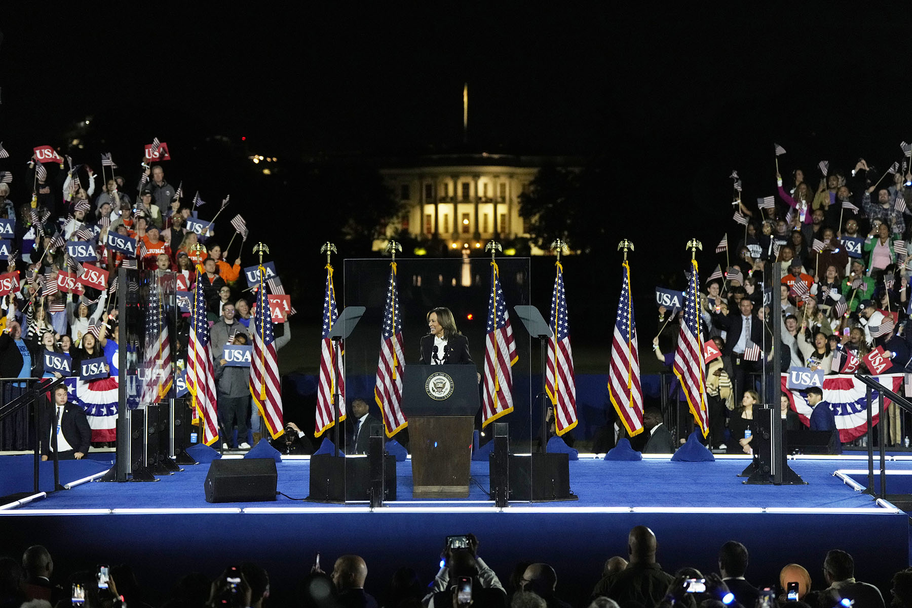 Vice President Kamala Harris speaks during a campaign rally on the Ellipse in Washington, D.C. The White House is seen in the background.