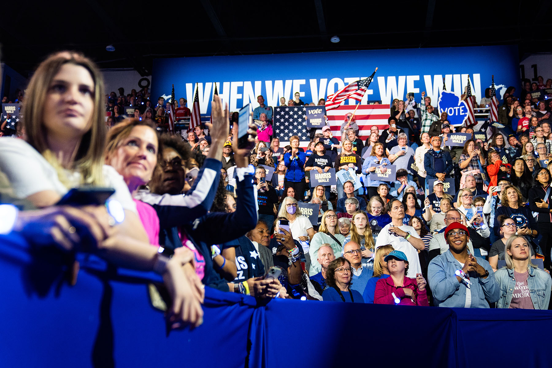 Supporters and attendees listen as Former First Lady Michelle Obama delivers remarks during Kamala Harris's campaign rally in Kalamazoo, Michigan.