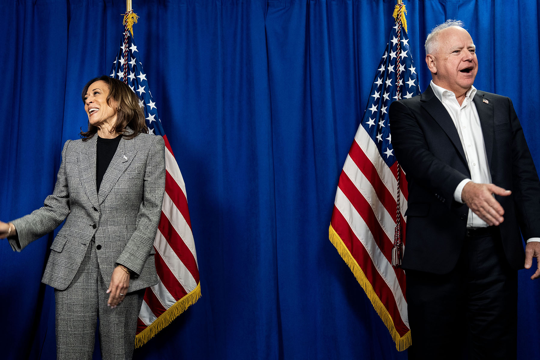 Vice President Harris and Vice Presidential running mate Gov. Tim Waltz speak to Michigan lawmakers during a "photo line" before a rally in Ann Arbor, Michigan.