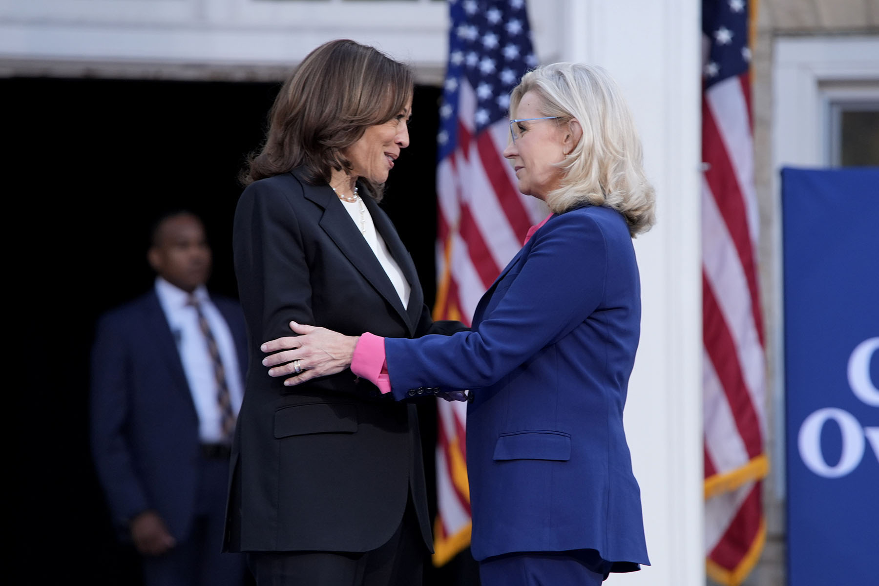 Former Congresswoman Liz Cheney greets Vice President Kamala Harris at a campaign event at Ripon College.