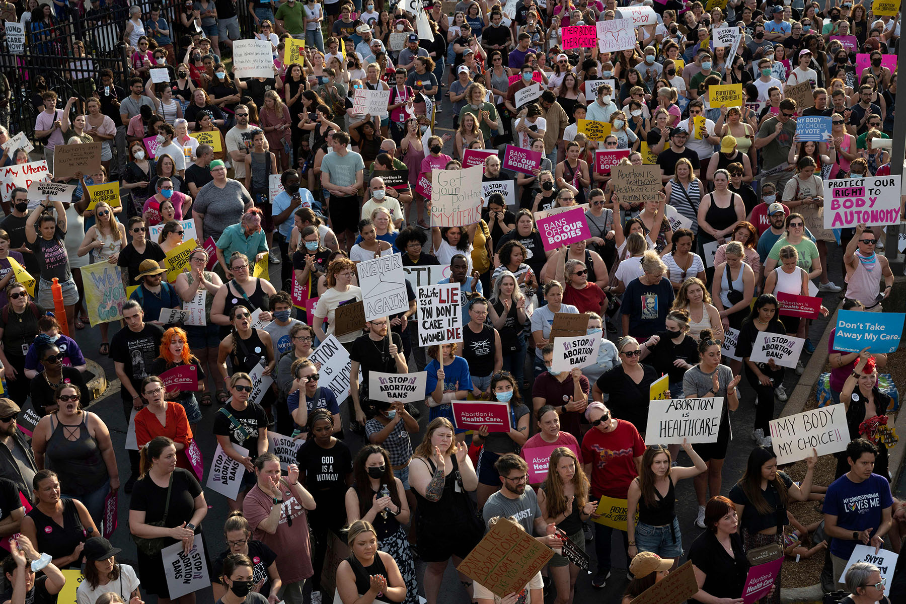 A large crowd of abortion rights protesters gather outside a Planned Parenthood clinic in St. Louis, holding signs supporting reproductive rights, in reaction to the Supreme Court's decision to overturn Roe v. Wade.