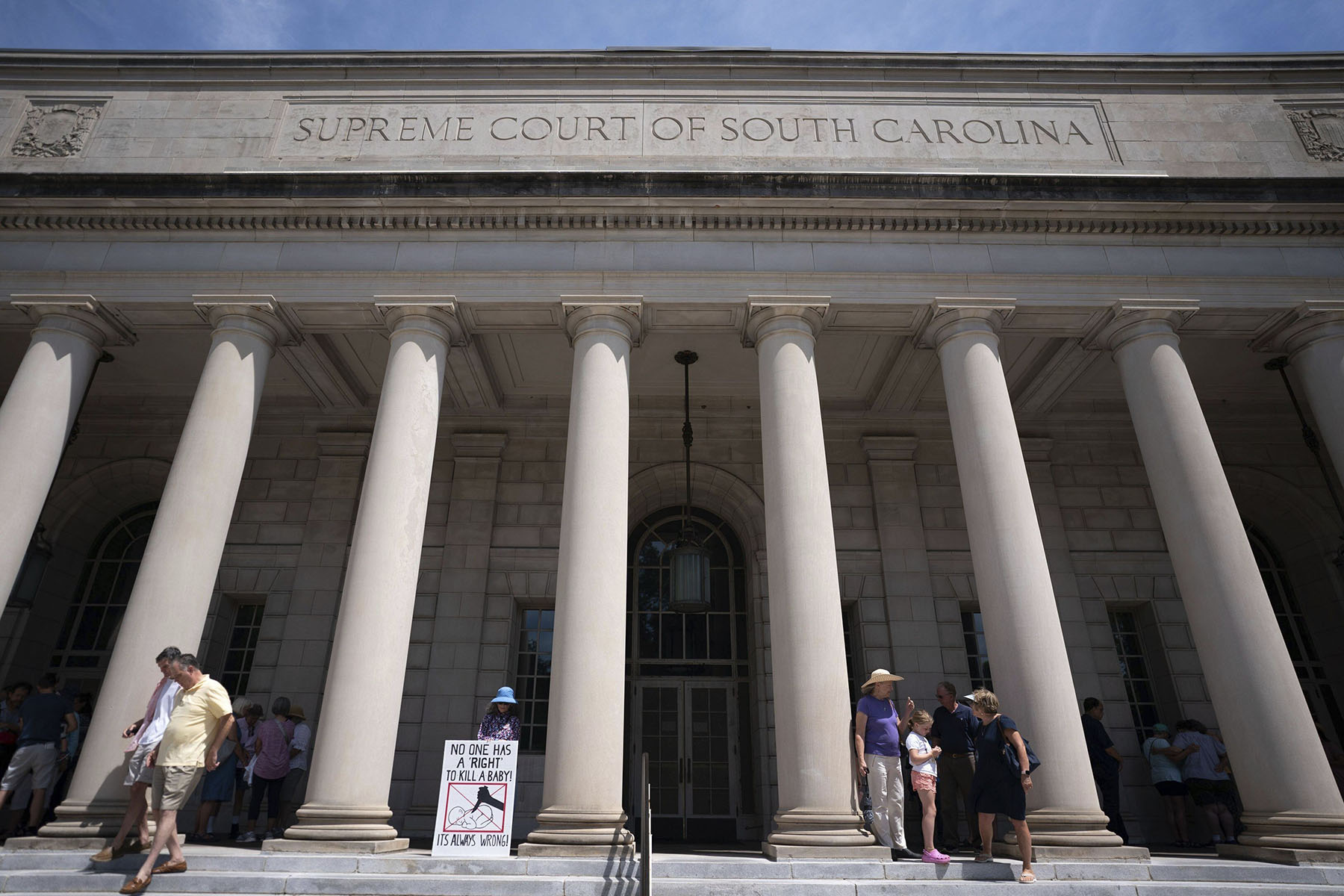 Demonstrators pray outside the South Carolina Supreme Court in anticipation of hearings on a recently passed abortion law in June 2023.