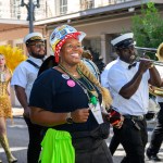 A tradeswoman wearing a Rosie the Riveter inspired bandana marches at the annual banner parade in New Orleans, Louisiana.