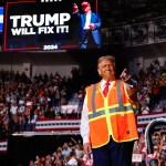 Former President Donald Trump points to supporters during a campaign event in Green Bay, Wisconsin.