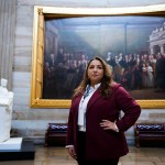 Rep. Delia Ramirez stands in the Capitol Rotunda.