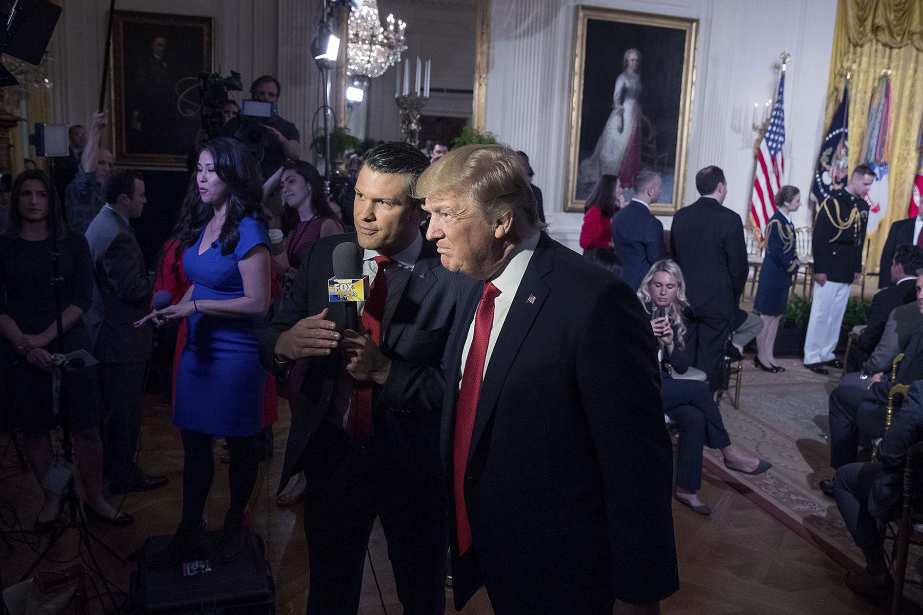 President Donald Trump appears on Fox&Friends with co-host Pete Hegseth during an event in the East Room of the White House.