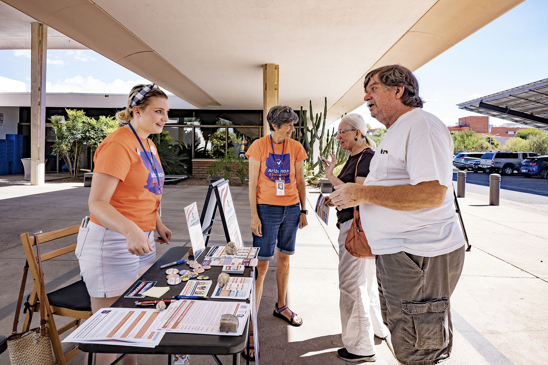 Activists discuss abortion access with voters at the entrance to the Murphy-Wilmot Library in Tucson, Arizona.