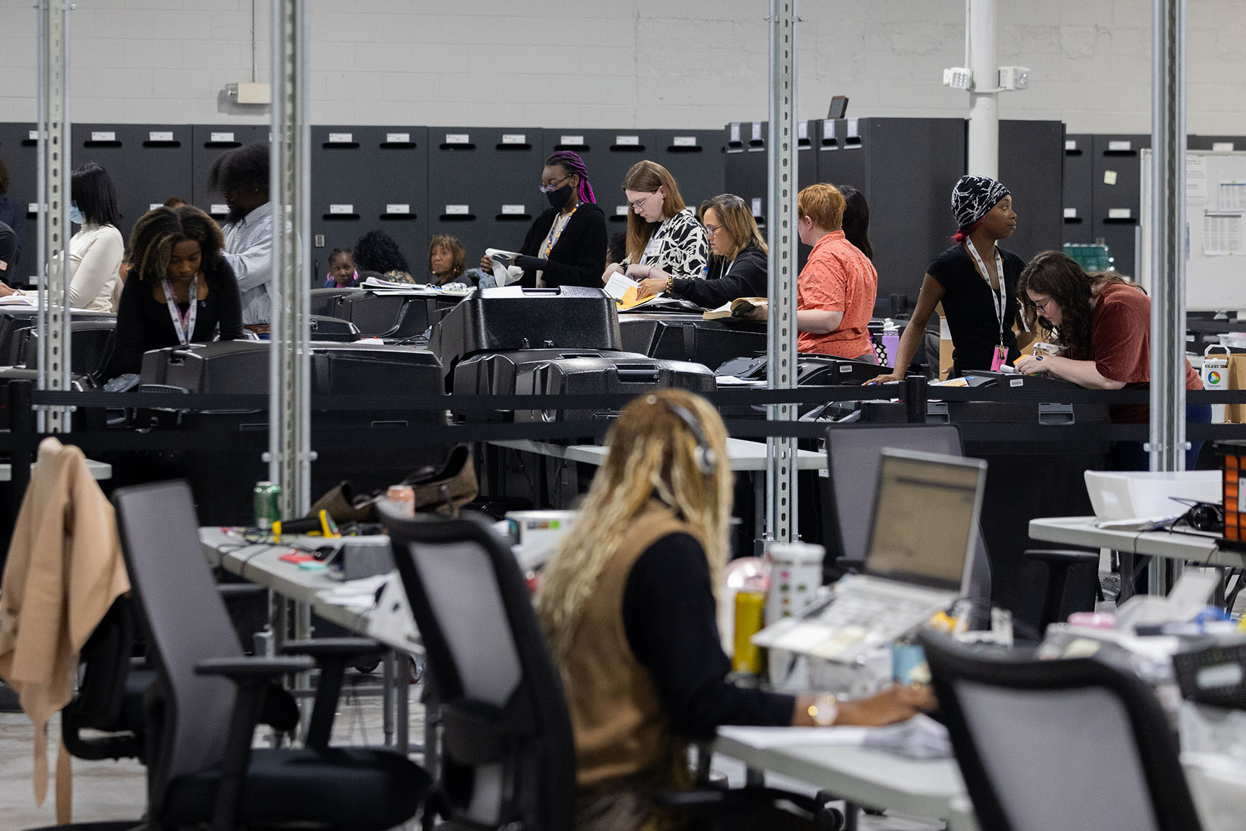 Election workers tabulate results of early voting and absentee ballots in Gwinnett County, Georgia.