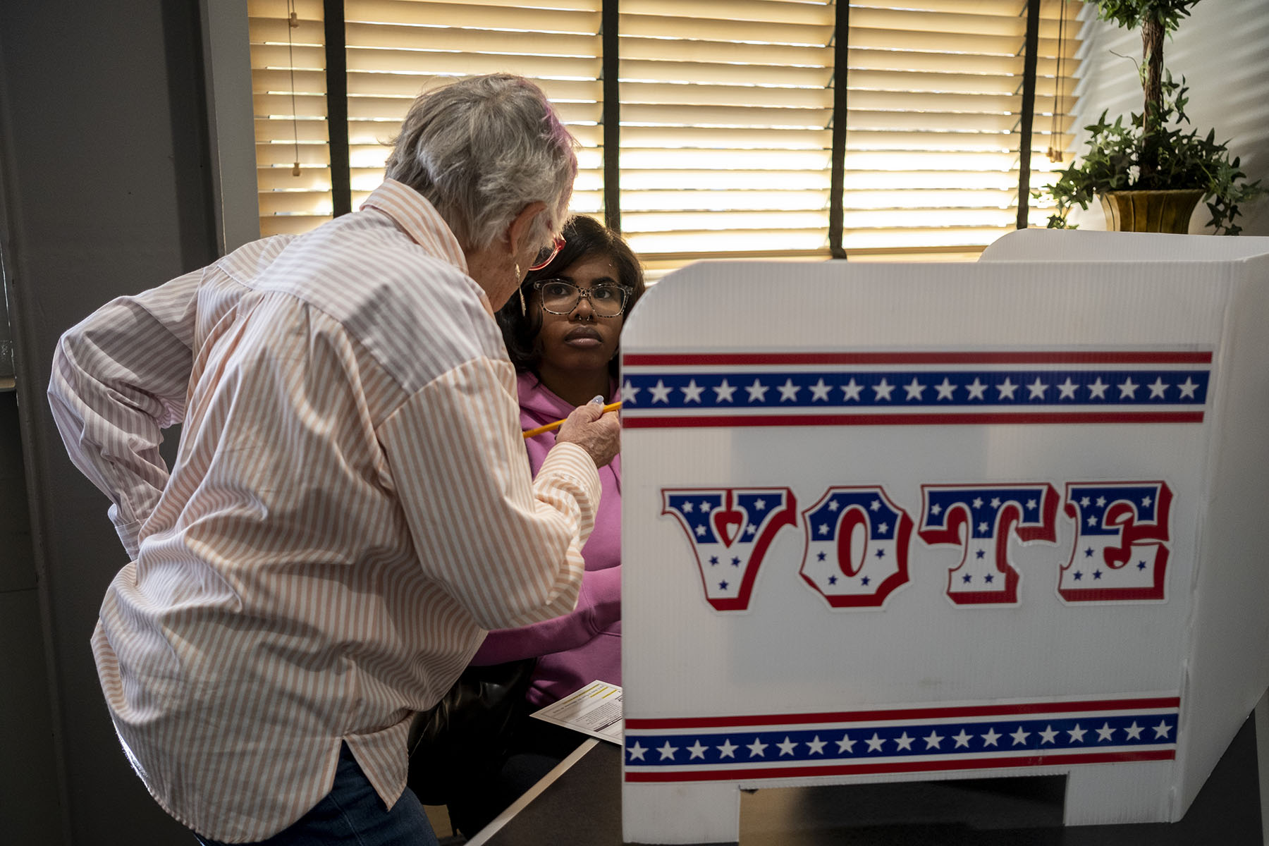 A woman votes at the Washington Park Library's early voting location in Milwaukee, Wisconsin.