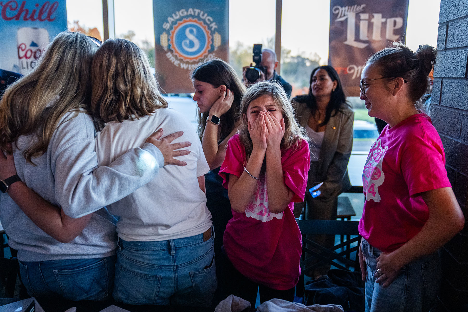 A young supporter reacts after meeting Vice President Kamala Harris at a Kalamazoo, Michigan restaurant.