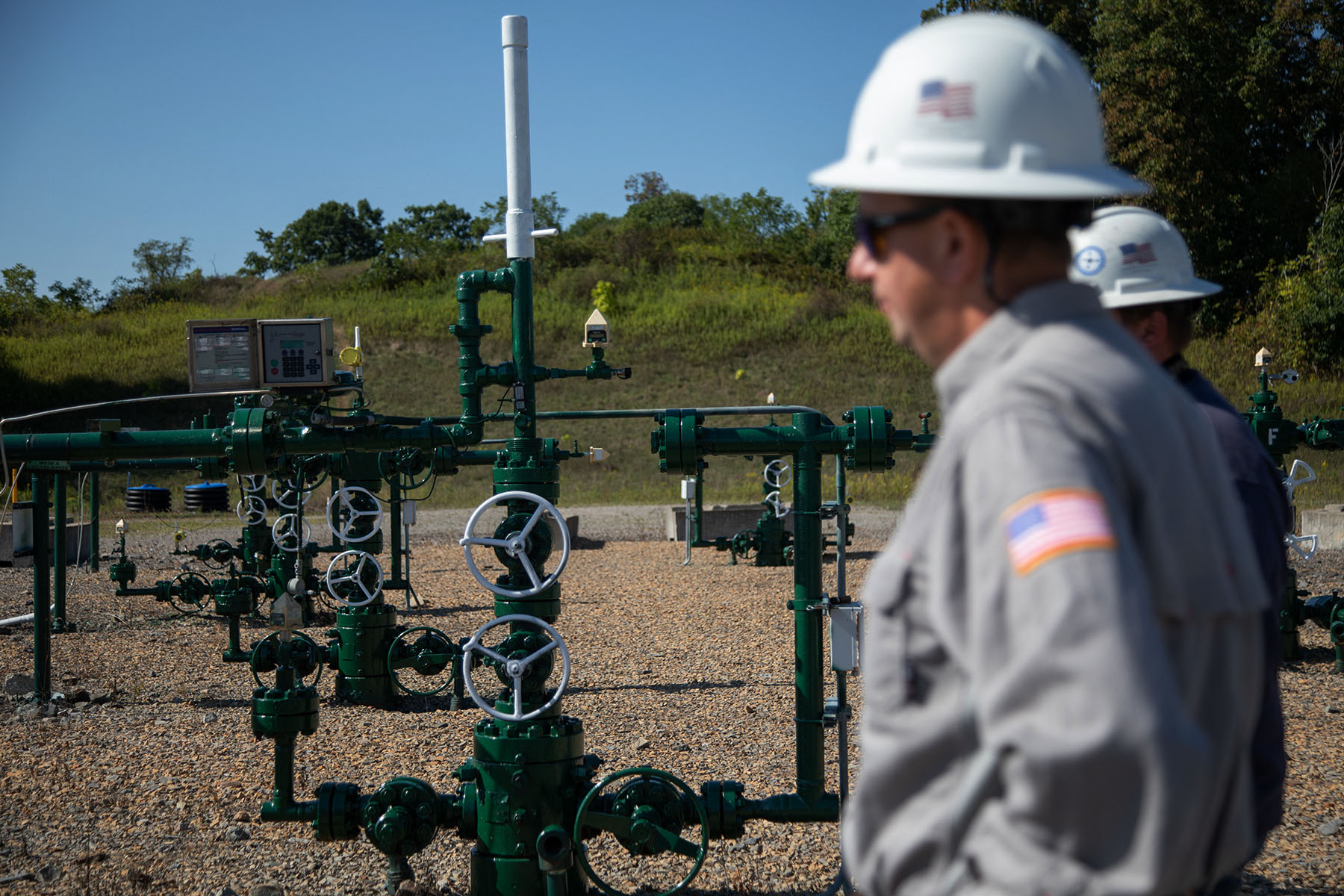 Diversified Energy employees stand by natural gas well in Franklin Township, Washington County, Pennsylvania.