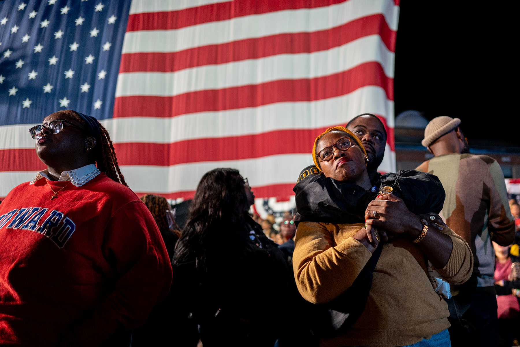 Supporters embrace as they watch poll results come in during an election night event for Vice President Kamala Harris at Howard University