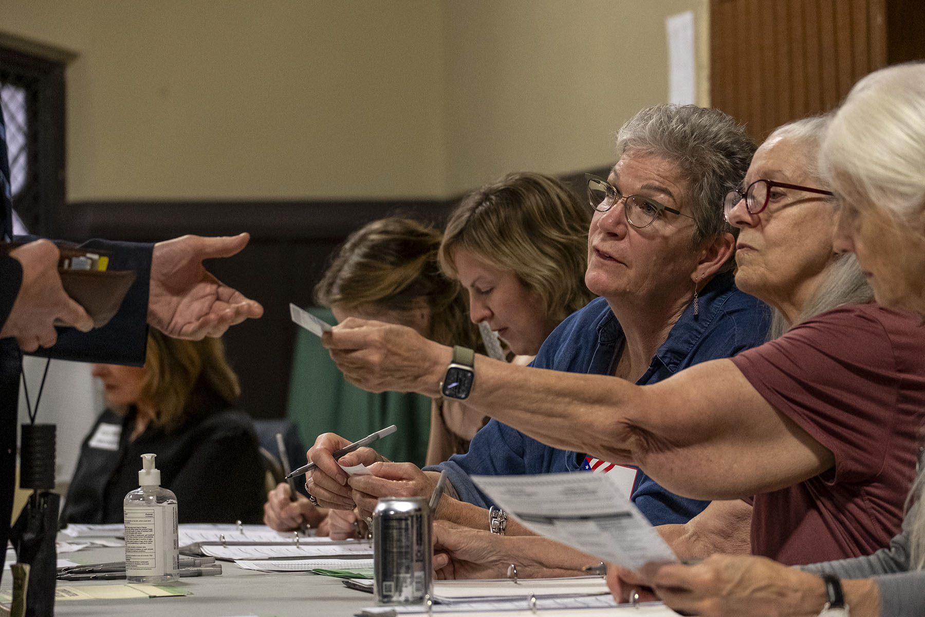 Election poll workers check in voters in Milwaukee, Wisconsin.