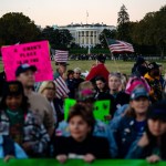 The White House is seen in the background as demonstrators gather at the Ellipse after The Women's March.