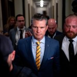 President-elect Donald Trump's nominee to be Secretary of Defense Pete Hegseth walks through the Russell Senate Office Building on Capitol Hill.