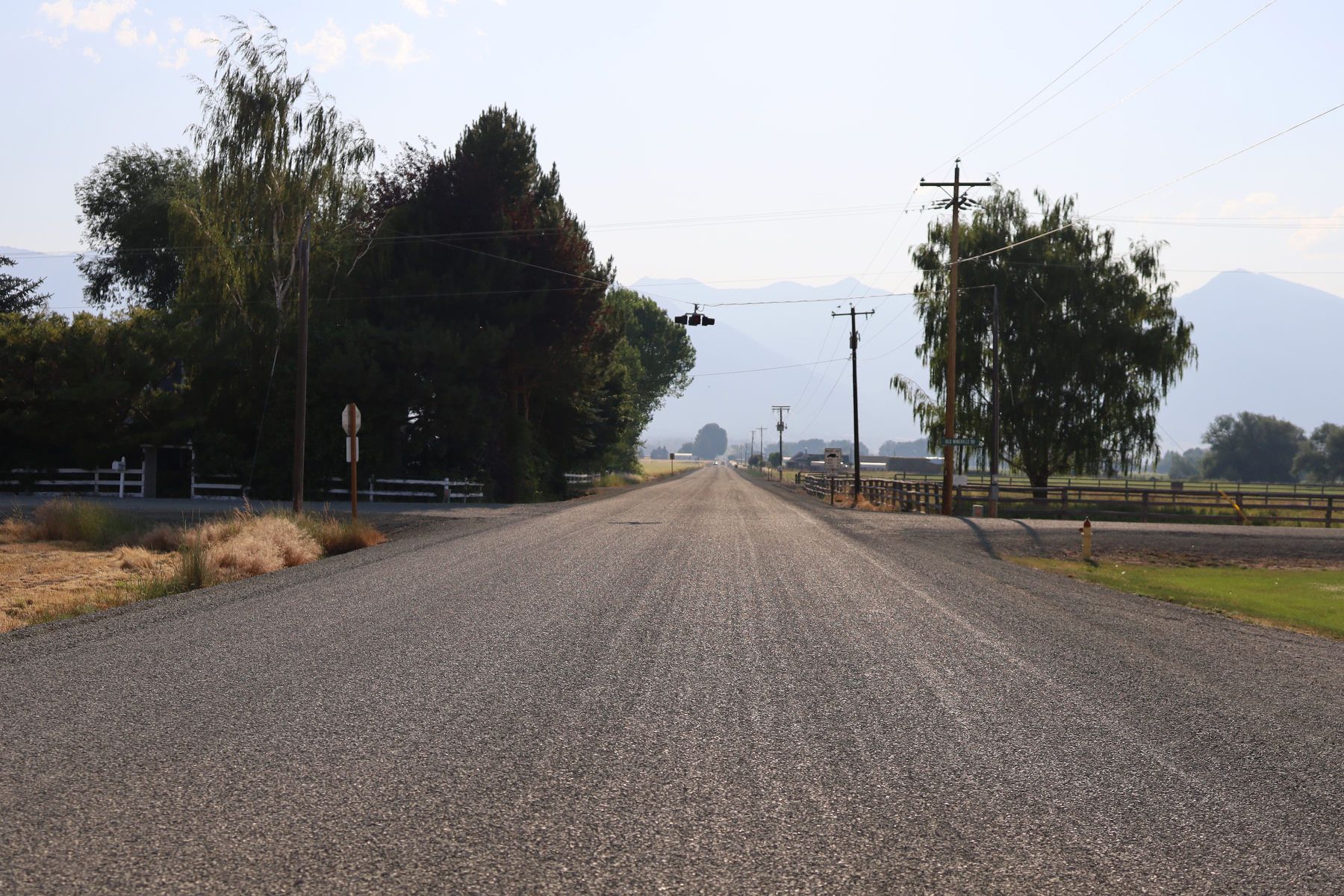 A rural road stretches into the distance.