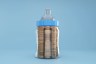A milk bottle filled with coins.