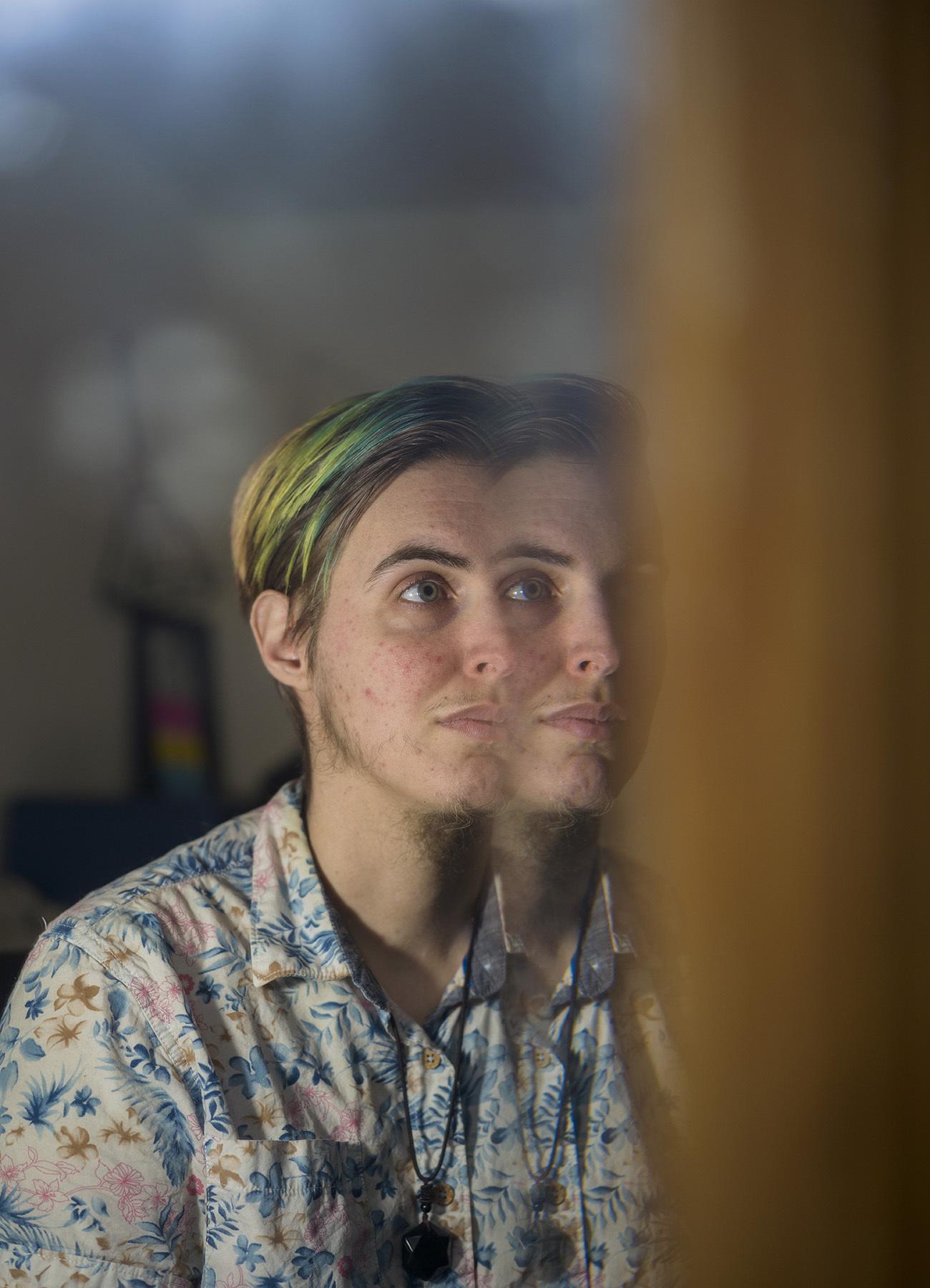 Ellis is reflected in a mirror.