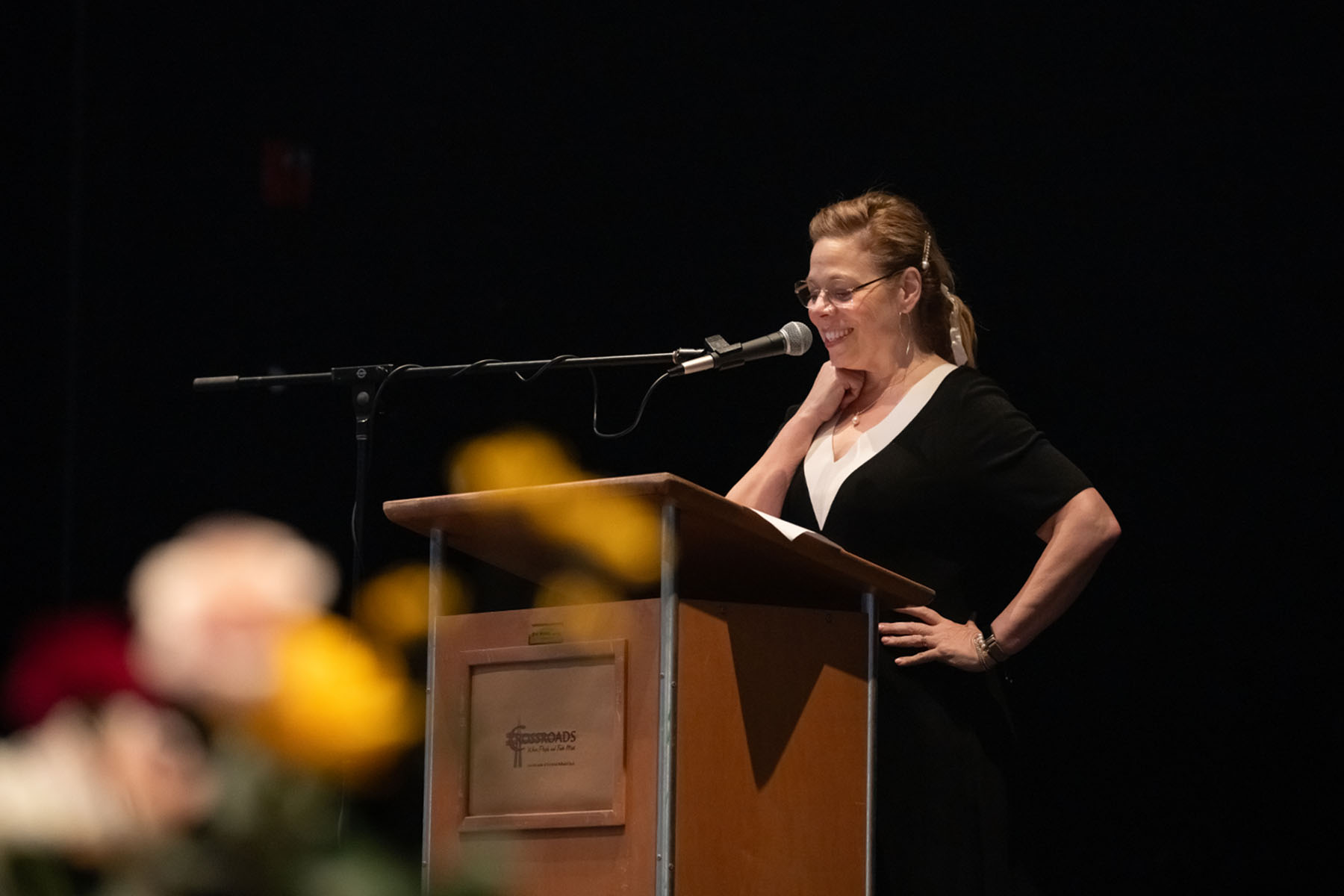 Fairfield County Auditor Carri Brown delivers opening remarks on stage at the We Rally & We Rise Women’s Conference.