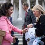 Rep. Anna Paulina Luna greets Rep. Brittany Pettersen and her infant son, Sam, outside the Capitol.