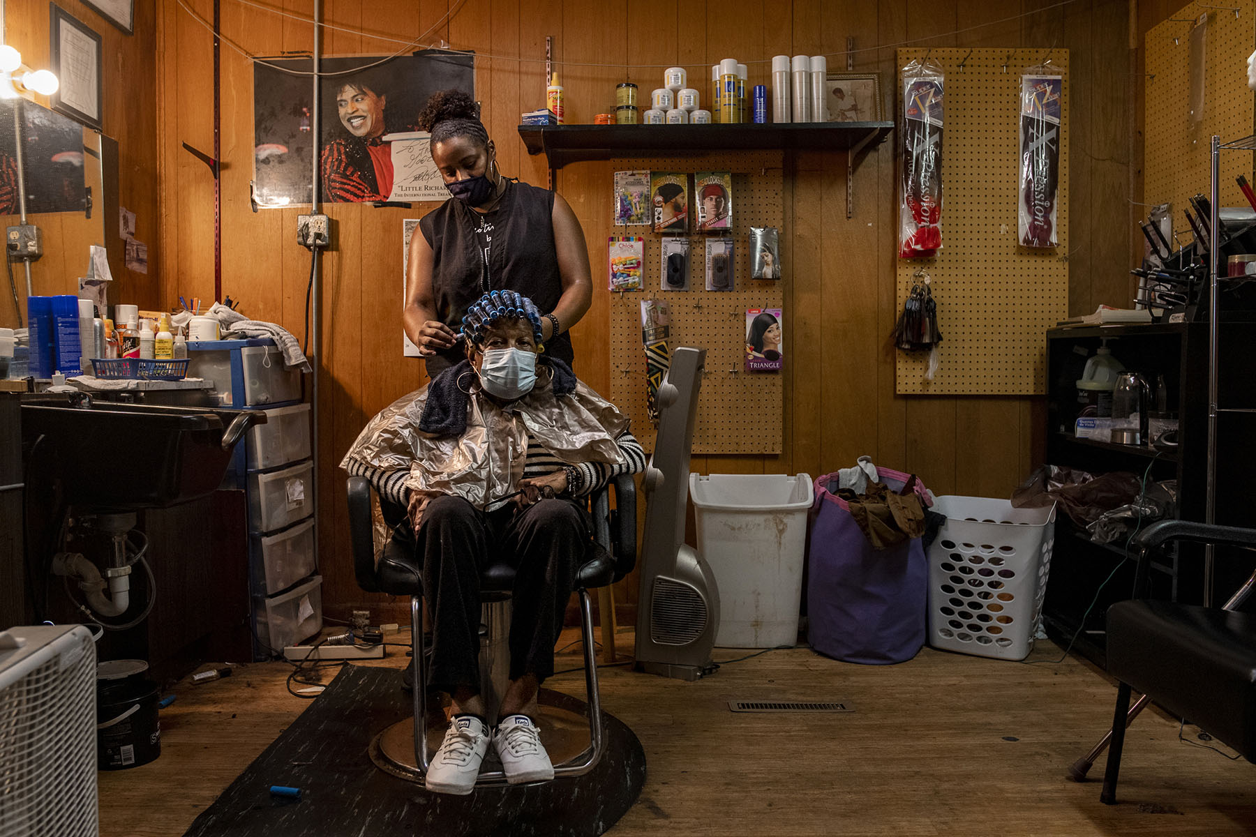 Octavia Cox styles her grandmother Freda Long's hair at Freda's Beauty Rama, her grandmother's salon in Cedar Rapids, Iowa.