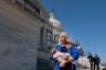 Rep. Brittany Pettersen holds her one-month old baby as she departs during a series of votes at the Capitol.