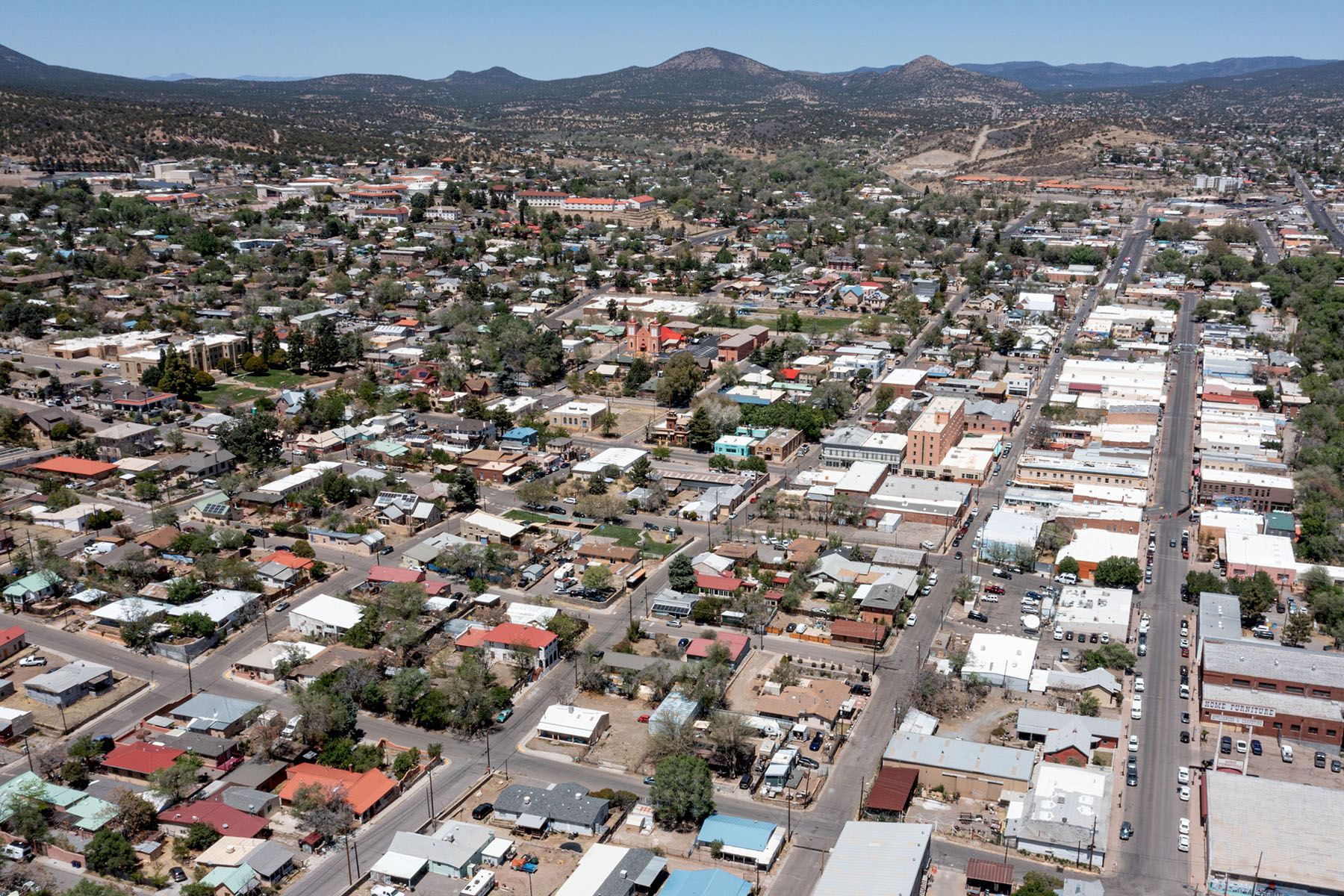 An aerial view of a small town mountainous landscape.