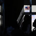 People wait in line to vote at the Oakland Career Center on November 5, 2024.