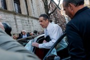 Former New York Gov. Andrew Cuomo is photographed getting in a car outside the West Side Institutional Synagogue.
