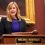 State Rep. Melissa Hortman, wearing a dark blazer and purple shirt, addressing the Minnesota Legislature as speaker in 2023.