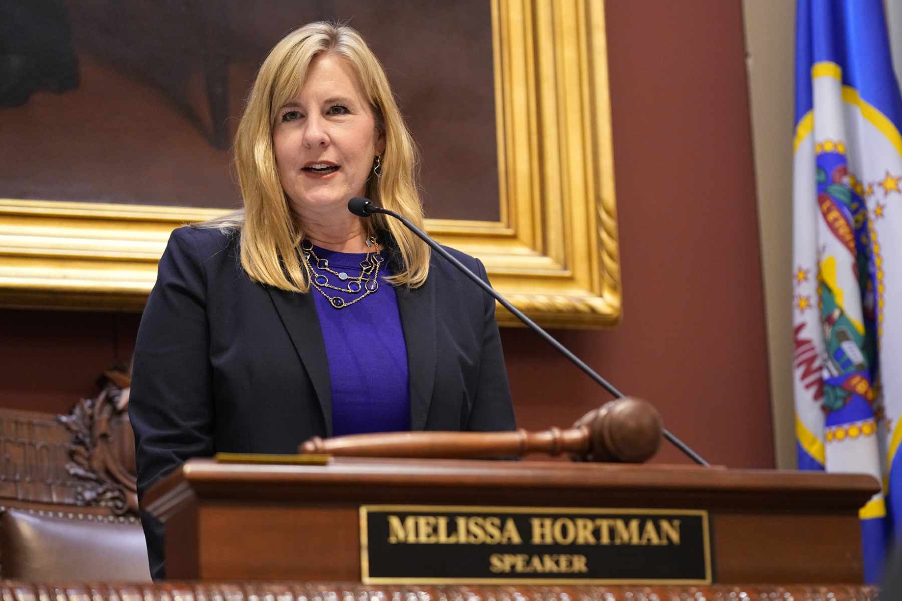 State Rep. Melissa Hortman, wearing a dark blazer and purple shirt, addressing the Minnesota Legislature as speaker in 2023.