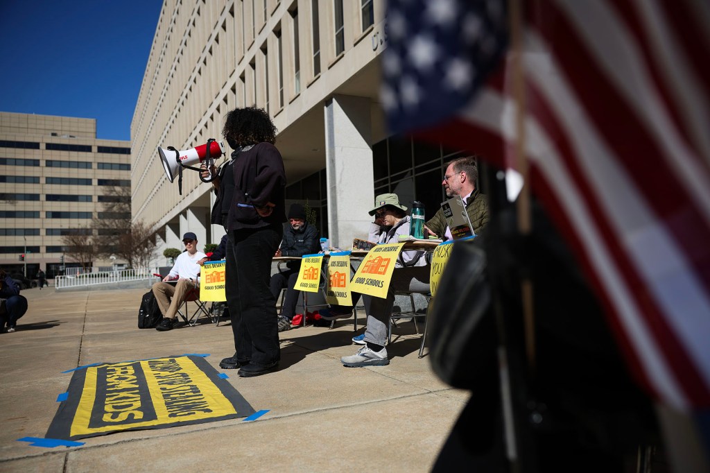 Protestors participate in a "study-in" in front of the Department of Education.
