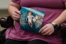 An in vitro fertilization patient at the University of Alabama at Birmingham holds up a photo of her daughter, who was conceived via the procedure.