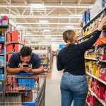 Customers shop for school supplies at a Walmart store.