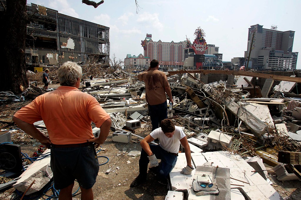 People view the wreckage of Hurricane Katrina by the Biloxi coast.