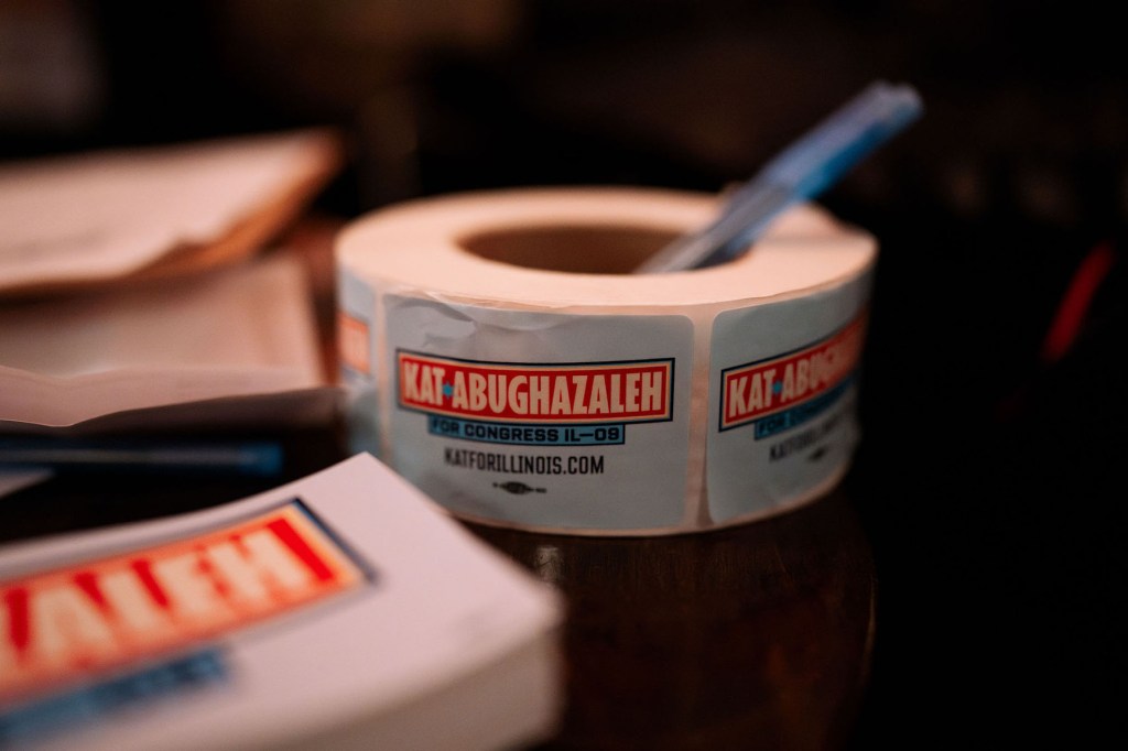 A roll of stickers for Kat Abughazaleh sits at the entrance of “Punks for Progress,” at G Man Tavern.