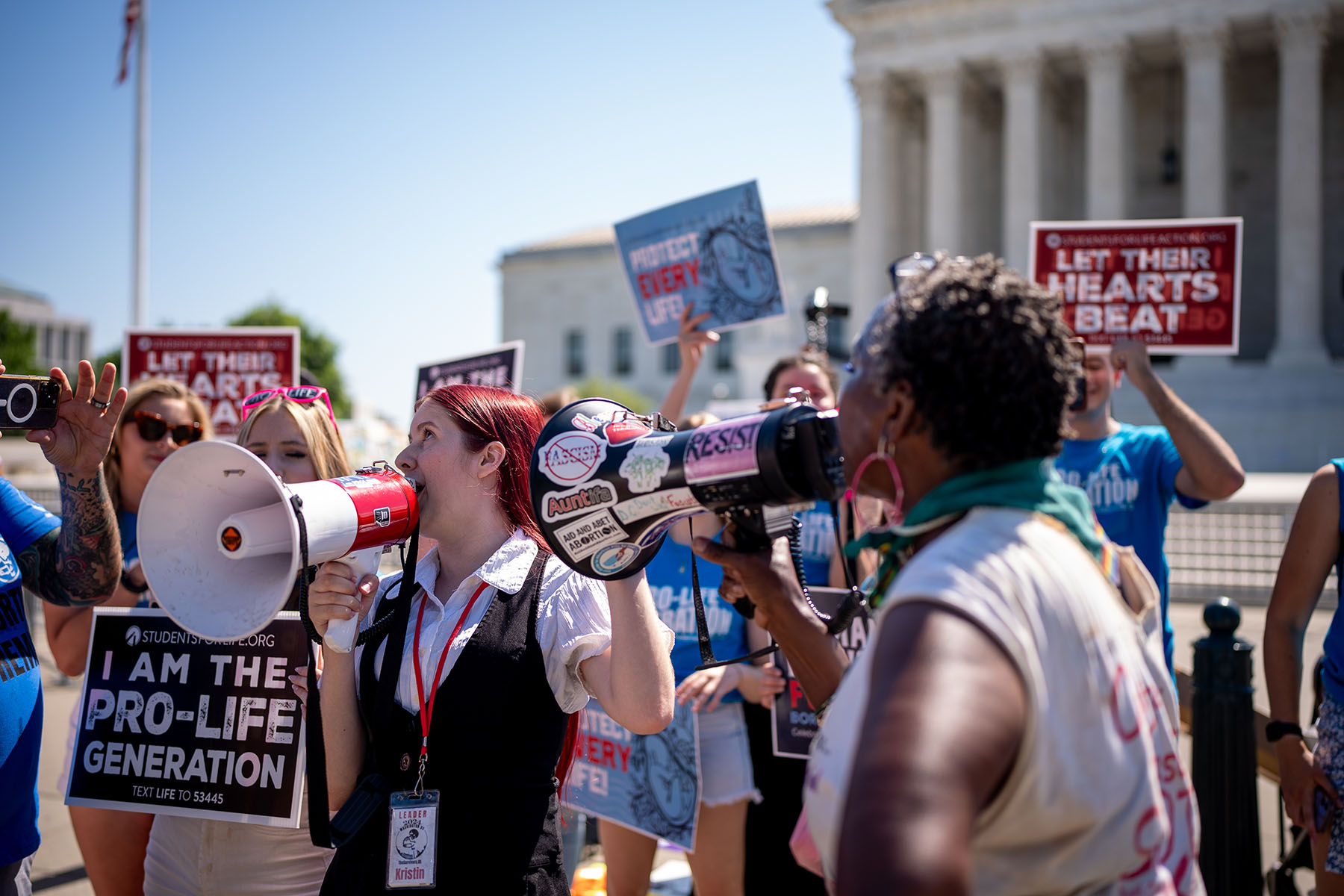 An abortion rights demonstrator confronts a group of anti-abortion protesters outside the Supreme Court.