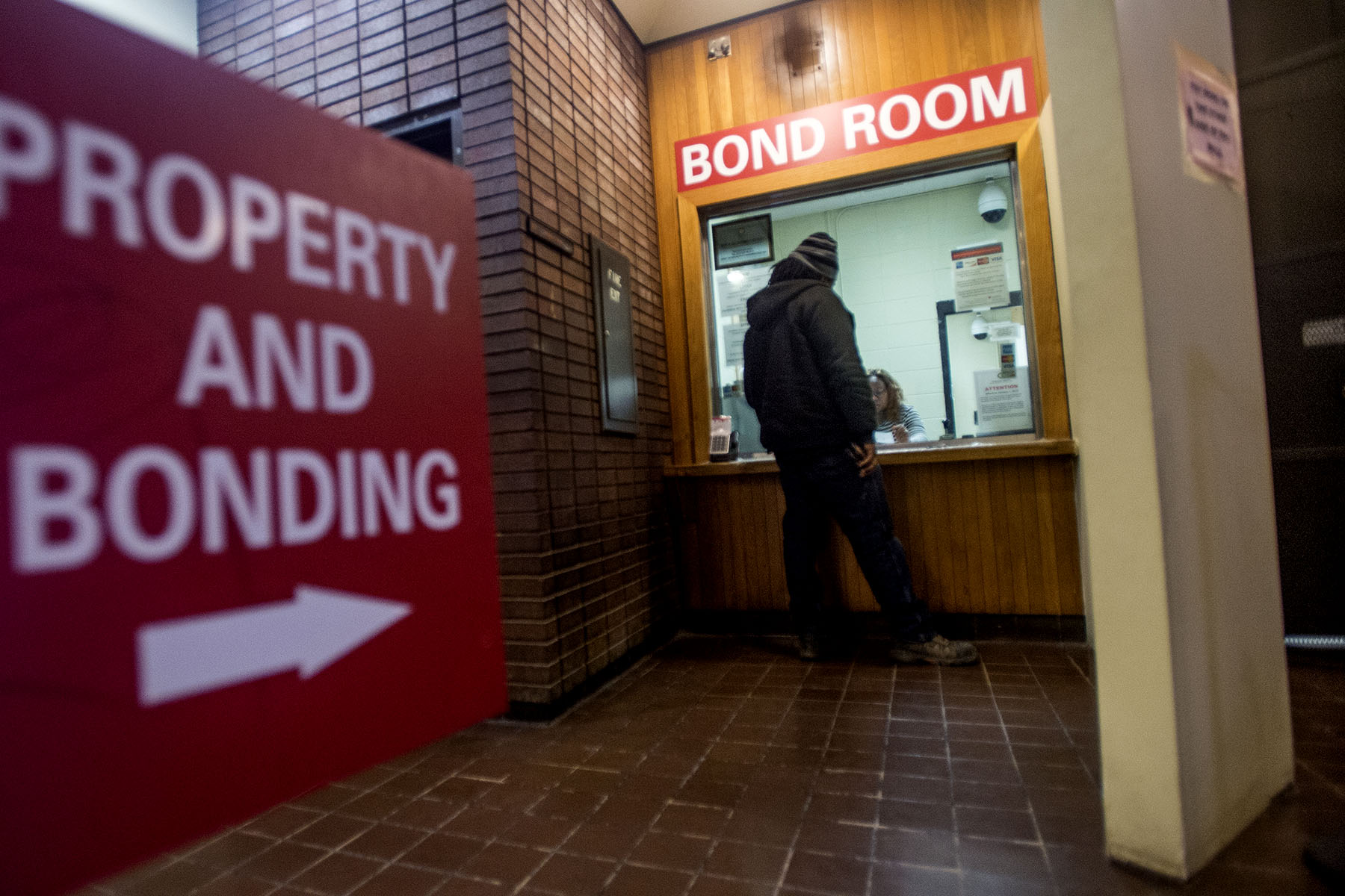 People post bail for themselves and their family members at the Bond room at the Cook County Jail