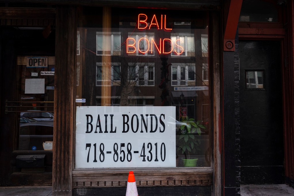 A sign advertises services for bail bonds along Atlantic Avenue near the Brooklyn Detention Complex.