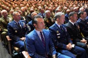 Defense Secretary Pete Hegseth sits with Chairman of the Joint Chiefs of Staff Air Force Gen. Dan Caine, third from right, and U.S. military senior leadership as they listen to President Donald Trump speaks at Marine Corps Base Quantico.