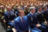 Defense Secretary Pete Hegseth sits with Chairman of the Joint Chiefs of Staff Air Force Gen. Dan Caine, third from right, and U.S. military senior leadership as they listen to President Donald Trump speaks at Marine Corps Base Quantico.