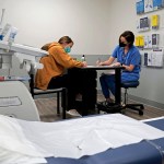A doctor speaks to a patient about the medical abortion process at a Planned Parenthood.