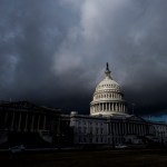 A view of the US Capitol enshrouded in dark clouds.