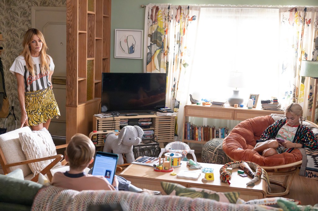 A scene from ABC show “High Potential" in which the protagonist stands in a living room with her kids.