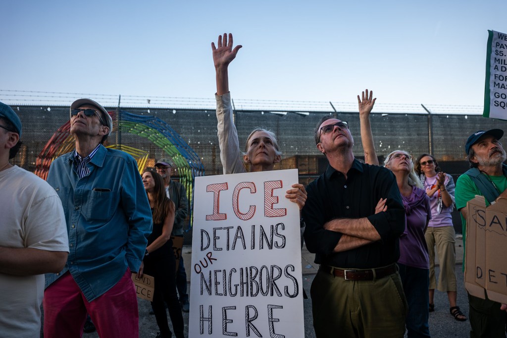 Dozens of people participate in an anti-ICE rally outside of the Brooklyn Metropolitan Detention Center.